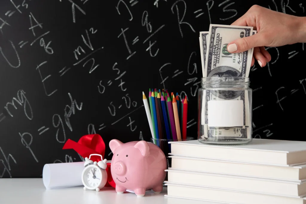 A close-up of a hand placing coins into a clear jar labeled "Savings," with a notebook and pen in the background, symbolizing essential budgeting and saving practices.  